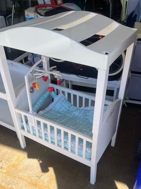 White Canopy Doll Crib with Blue Plaid Bedding and Heart Mobile